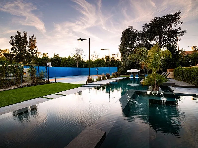 Outdoor Pool and seating area and basketball court